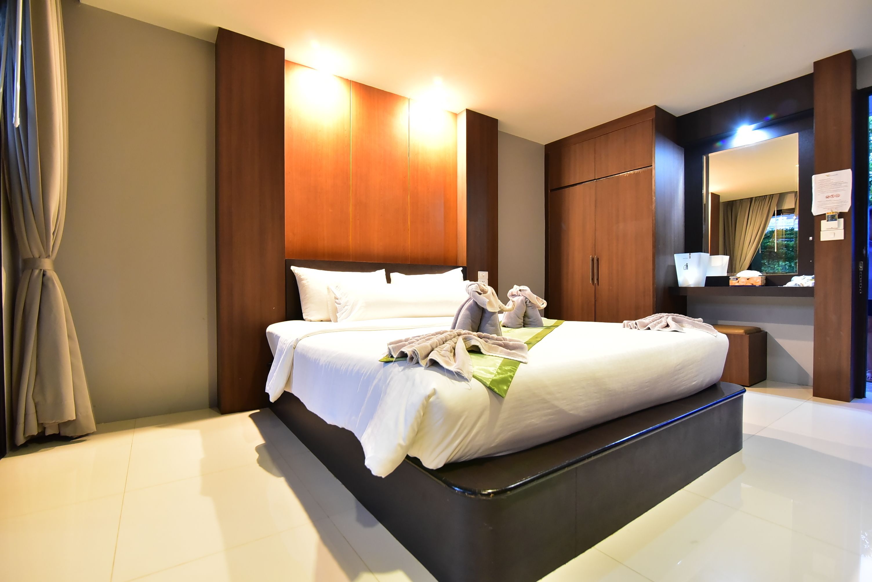 deluxe double room garden view with balcony | in-room safe, blackout curtains, cots/infant beds, rollaway beds