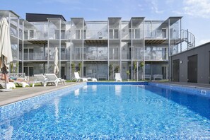 Seasonal outdoor pool, open 9:00 AM to 5:00 PM, sun loungers