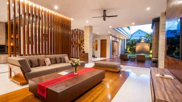 Three Bedrooms Grand Suite Villa | Living area | 59-inch Smart TV with satellite channels