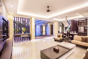 Three Bedrooms Pool Suite Villa | Living area | 59-inch Smart TV with satellite channels