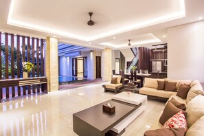 Three Bedrooms Pool Suite Villa | Living area | 59-inch Smart TV with satellite channels - The Amarta Villa (Jimbaran)