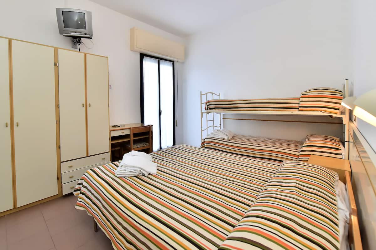 Economy Quadruple Room | In-room safe, desk, free WiFi, bed sheets