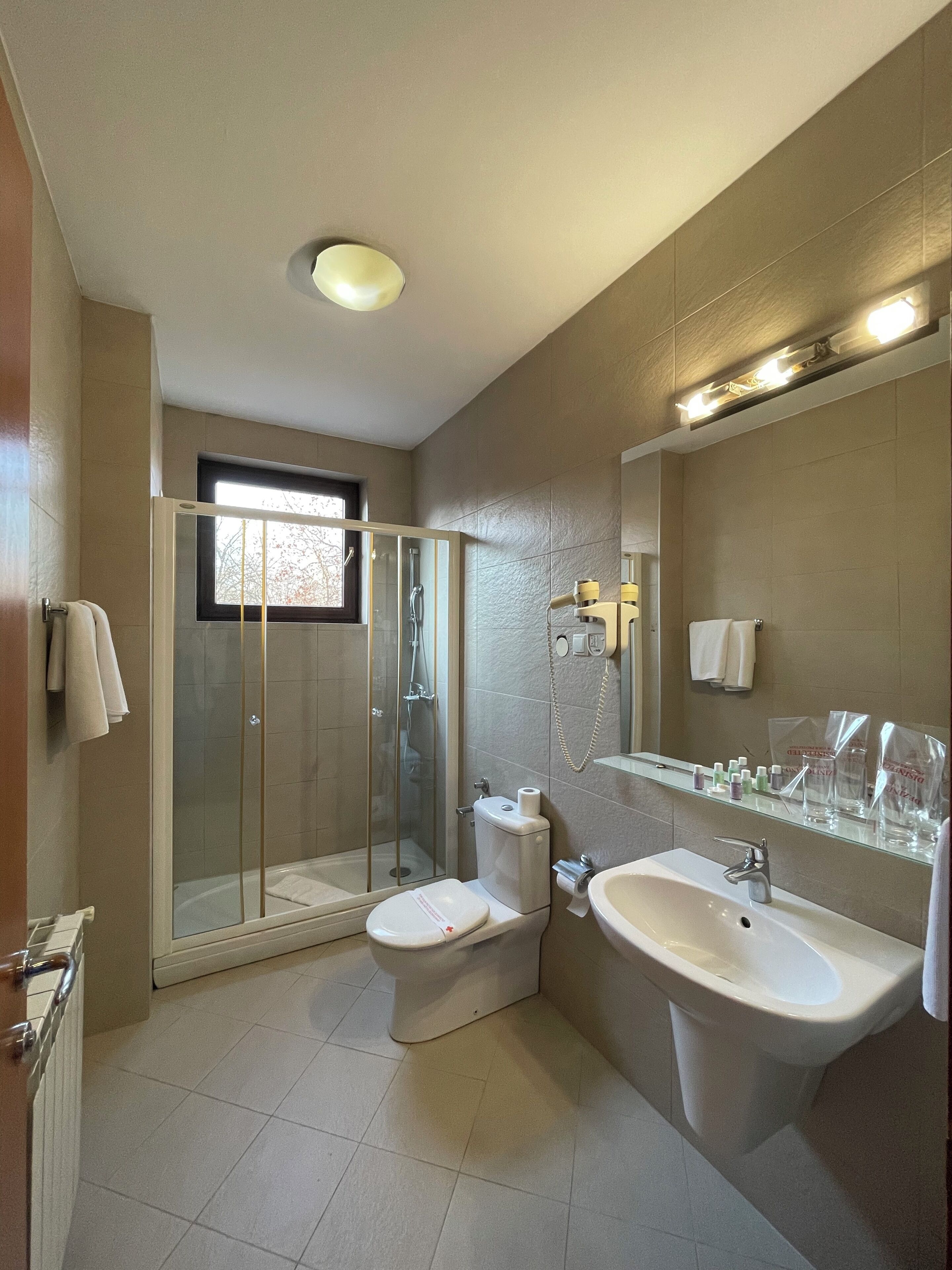 combined shower/bathtub, free toiletries, hair dryer, bathrobes