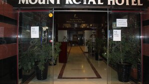 The entrance to Mount Royal Hotel with a sign indicating the bar and disco are closed. - Mount Royal Hotel (Dubai)