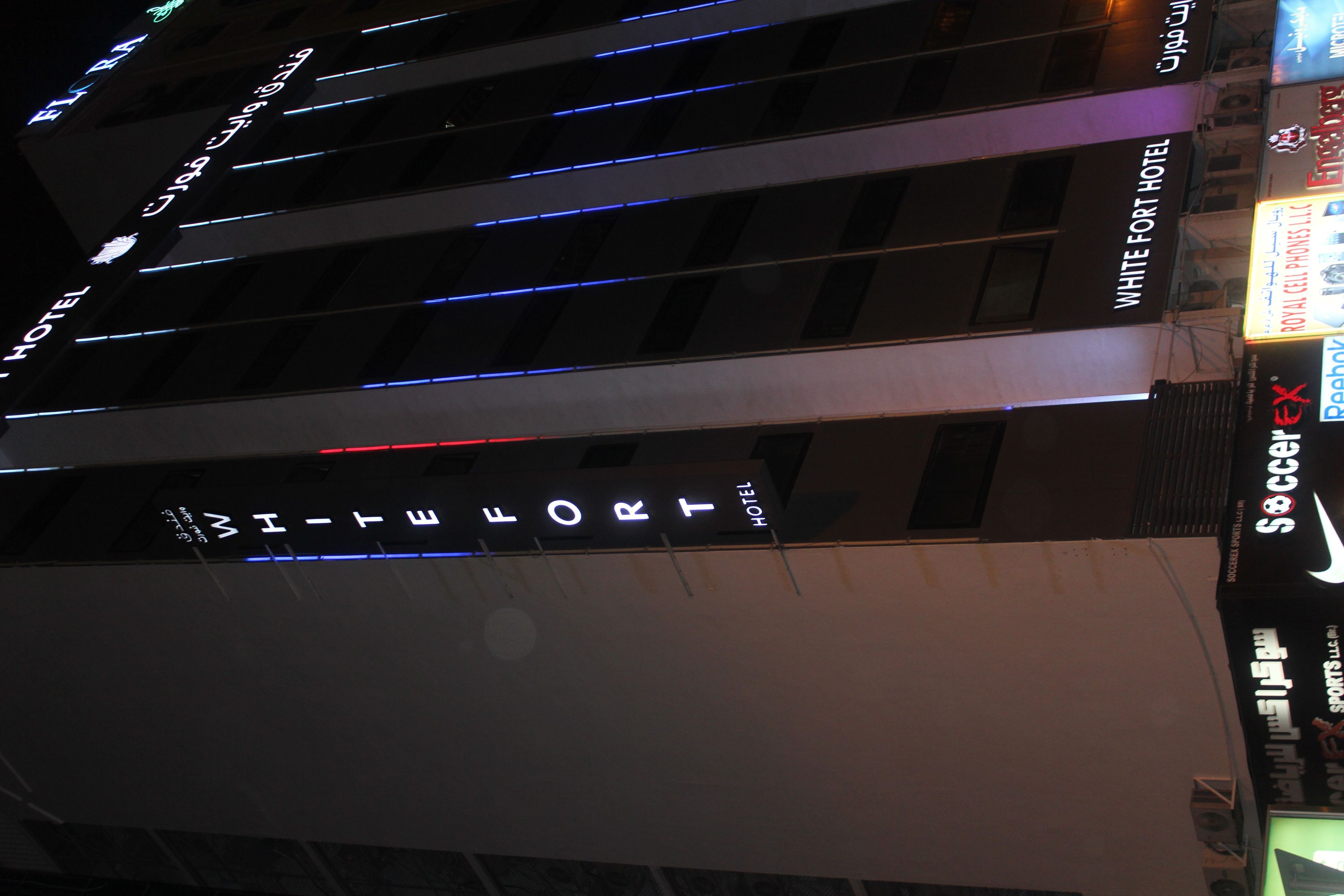 A hotel sign with the name "WHITE FORT HOTEL".