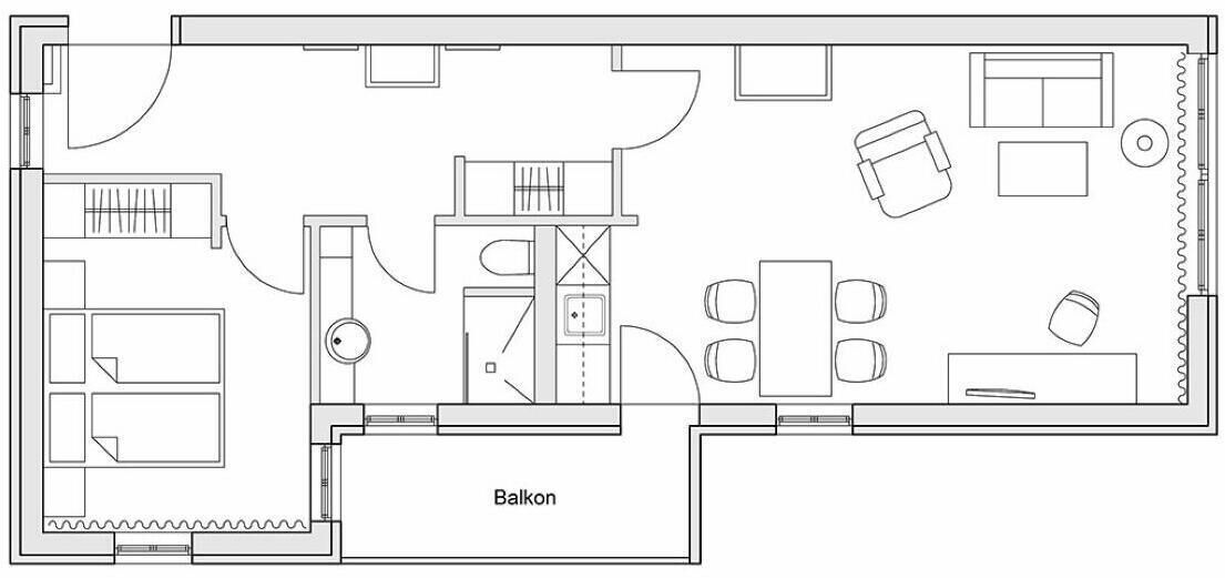 Ein Grundriss mit Balkon, Küche, Essbereich und Bad.