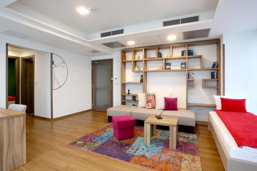 deluxe suite, 2 bedrooms | living area | flat-screen tv