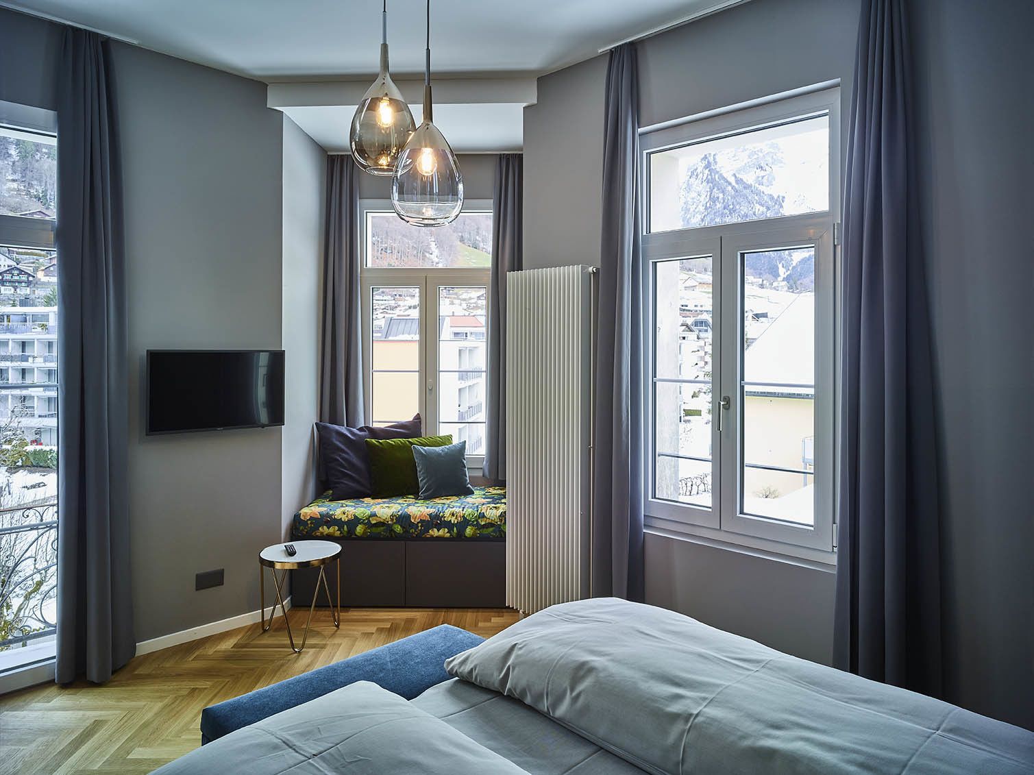 superior double room, mountain view (medium) | living area | 60-inch flat-screen tv with cable channels, tv, dvd player