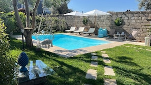 Seasonal outdoor pool, open 9:00 AM to 6:00 PM, pool umbrellas