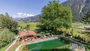 Seasonal outdoor pool, open 10:00 AM to 6:00 PM, pool umbrellas