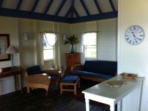 Cottage, Balcony, Ocean View (Breeze) | Living area - Galley Bay Cottages (St. John's)