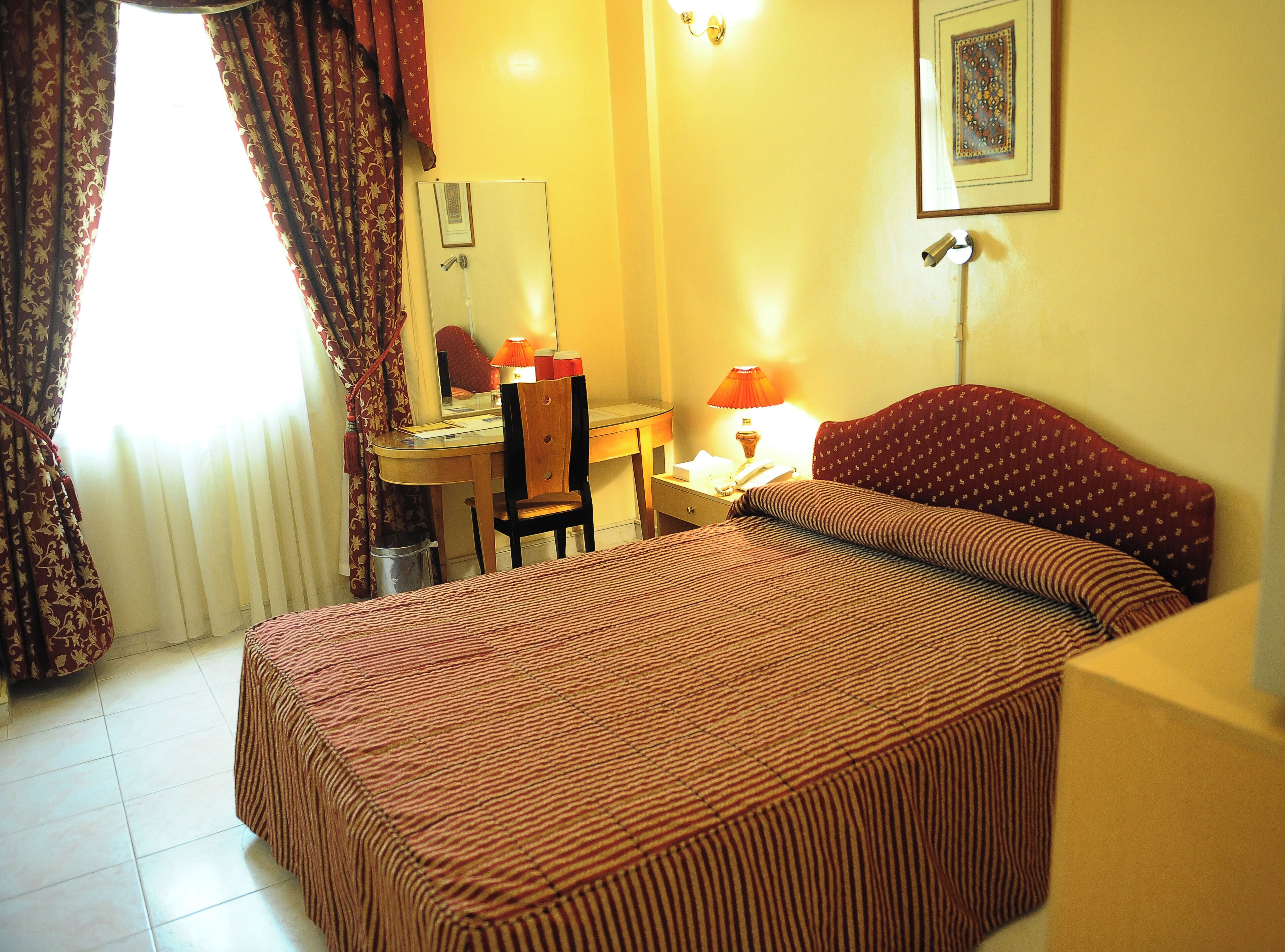 Standard Single Room | Minibar, in-room safe, desk, iron/ironing board