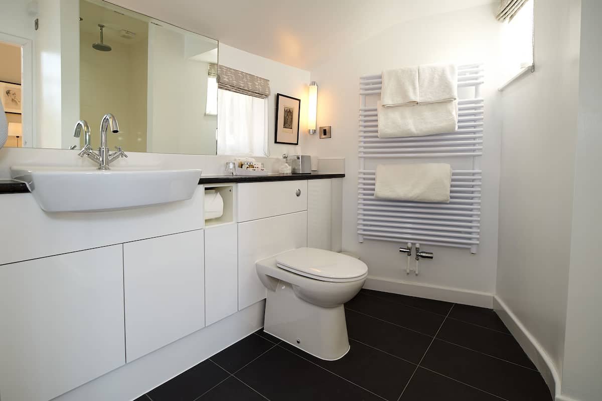 standard double or twin room (village) | bathroom | combined shower/bathtub, designer toiletries, hair dryer, towels