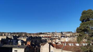 A historic town with dense, closely packed buildings and a prominent church tower.