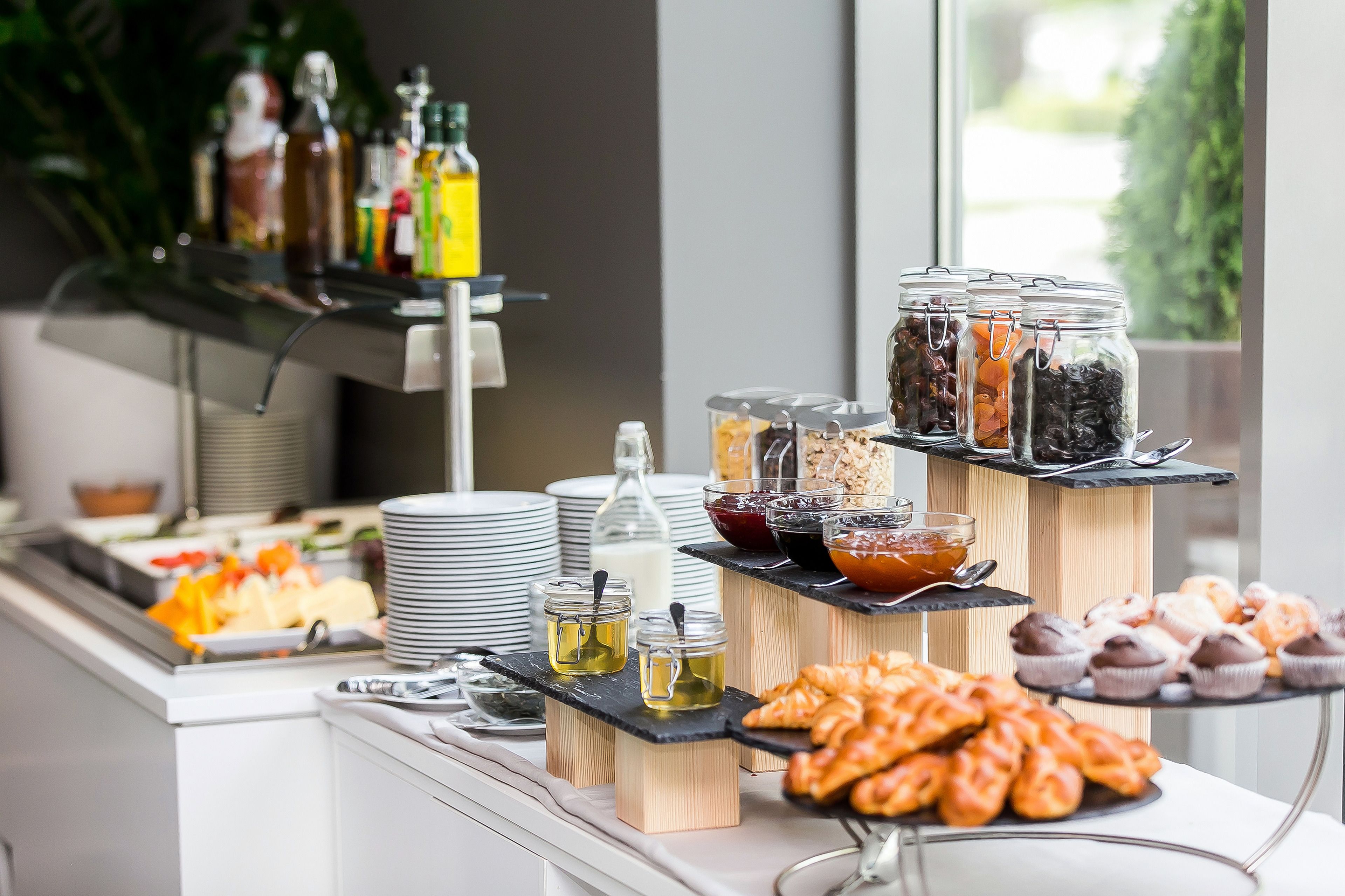 A buffet with various food items and condiments.
