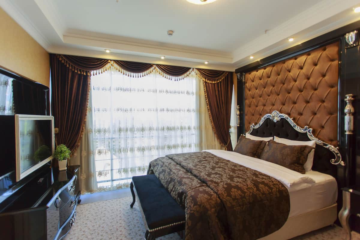 Suite, 1 camera da letto | Biancheria da letto di alta qualità, minibar, una cassaforte in camera