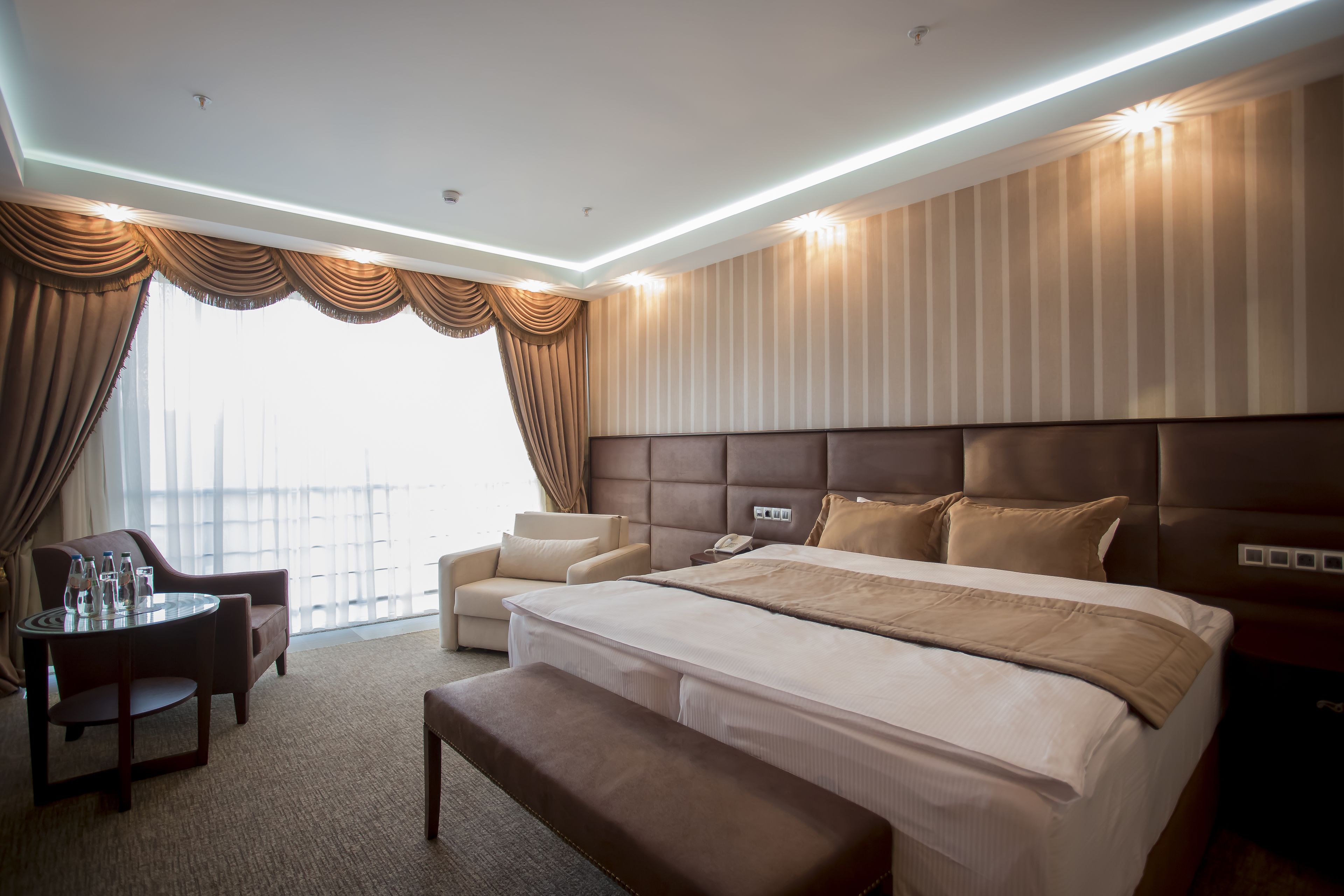 family room | premium bedding, minibar, in-room safe, iron/ironing board