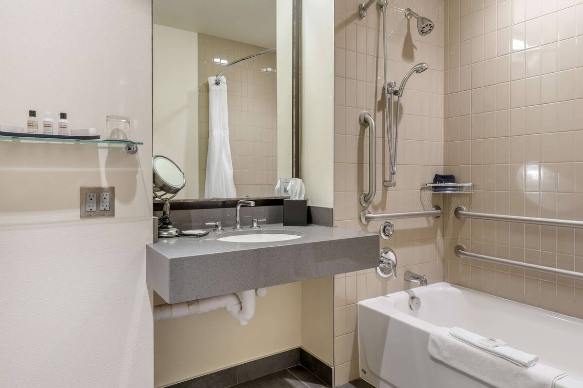 designer toiletries, hair dryer, bathrobes, towels