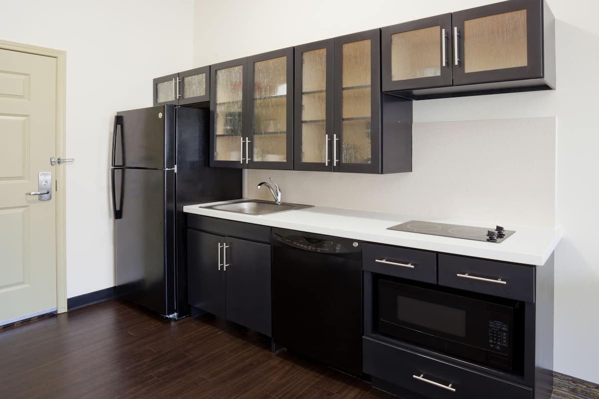 full-sized fridge, microwave, stovetop, dishwasher