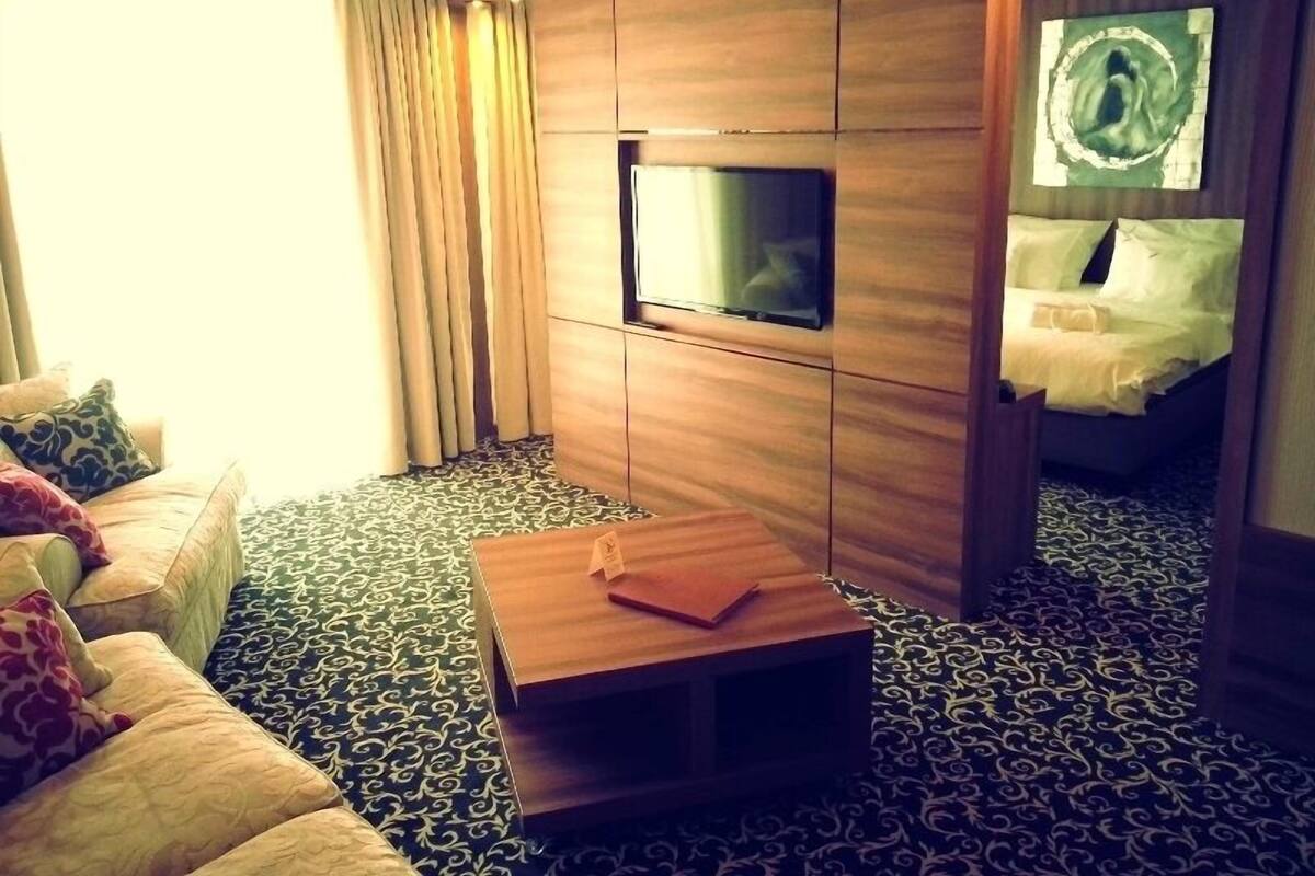 Junior Suite, Terrace | Living area | TV