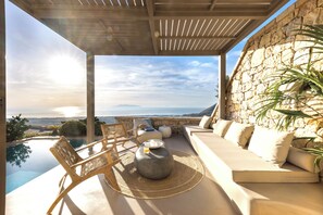 Senior Villa, Private Pool | Living area | 32-inch flat-screen TV with satellite channels, TV, DVD player - Eolia Luxury Villas (Santorini)