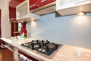 Deluxe Apartment, 2 Bedrooms, City View | Private kitchen | Full-sized fridge, microwave, stovetop, dishwasher