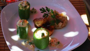 A plate with stuffed vegetables and a garnish.