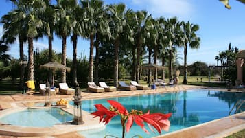 Outdoor pool, open 9 AM to 7:30 PM, free pool cabanas, pool umbrellas