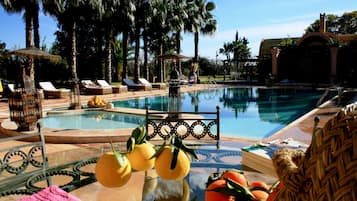 Outdoor pool, open 9 AM to 7:30 PM, free pool cabanas, pool umbrellas