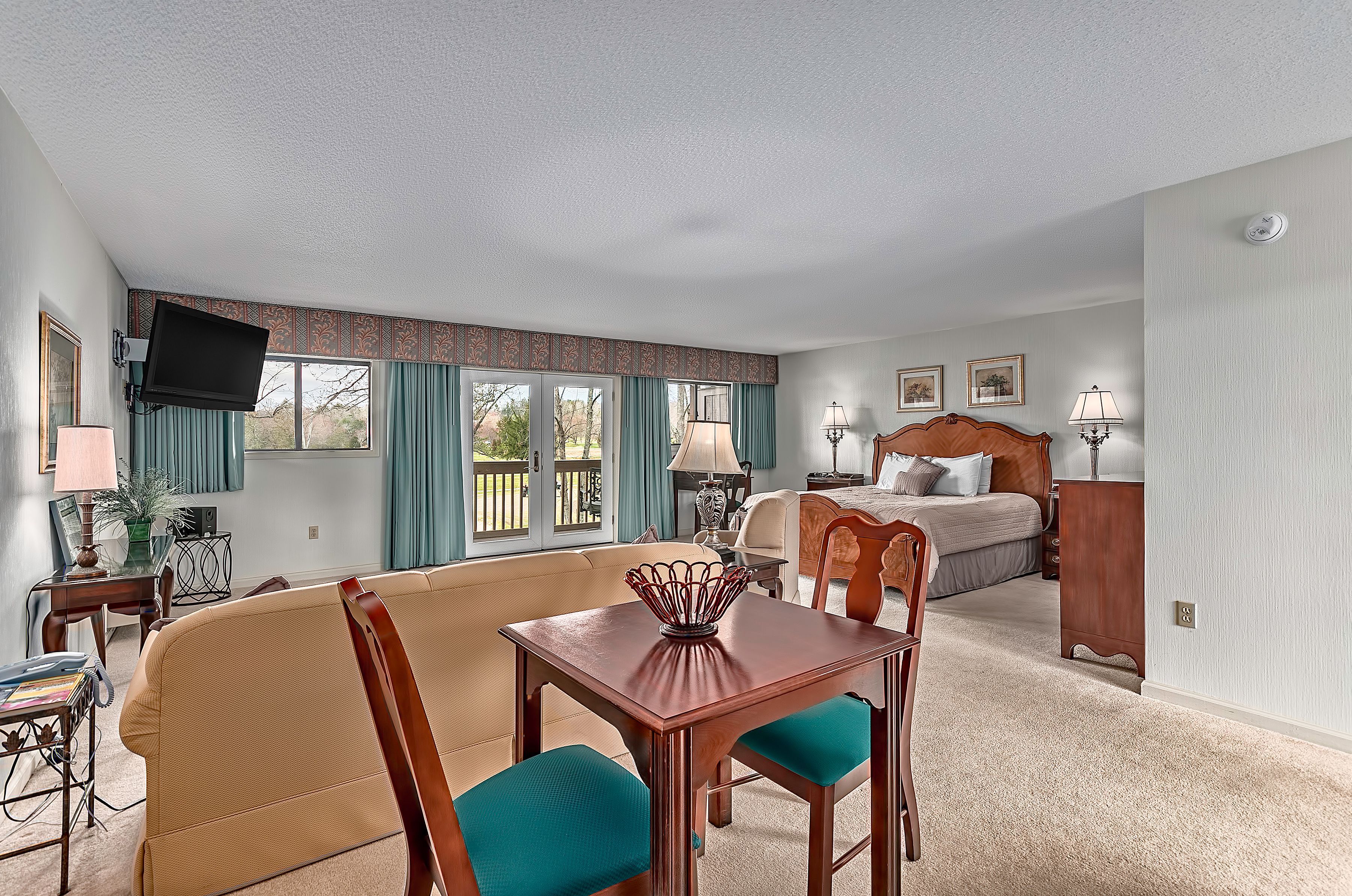 suite, 1 king bed with sofa bed, refrigerator & microwave, golf view | premium bedding, desk, blackout curtains, soundproofing