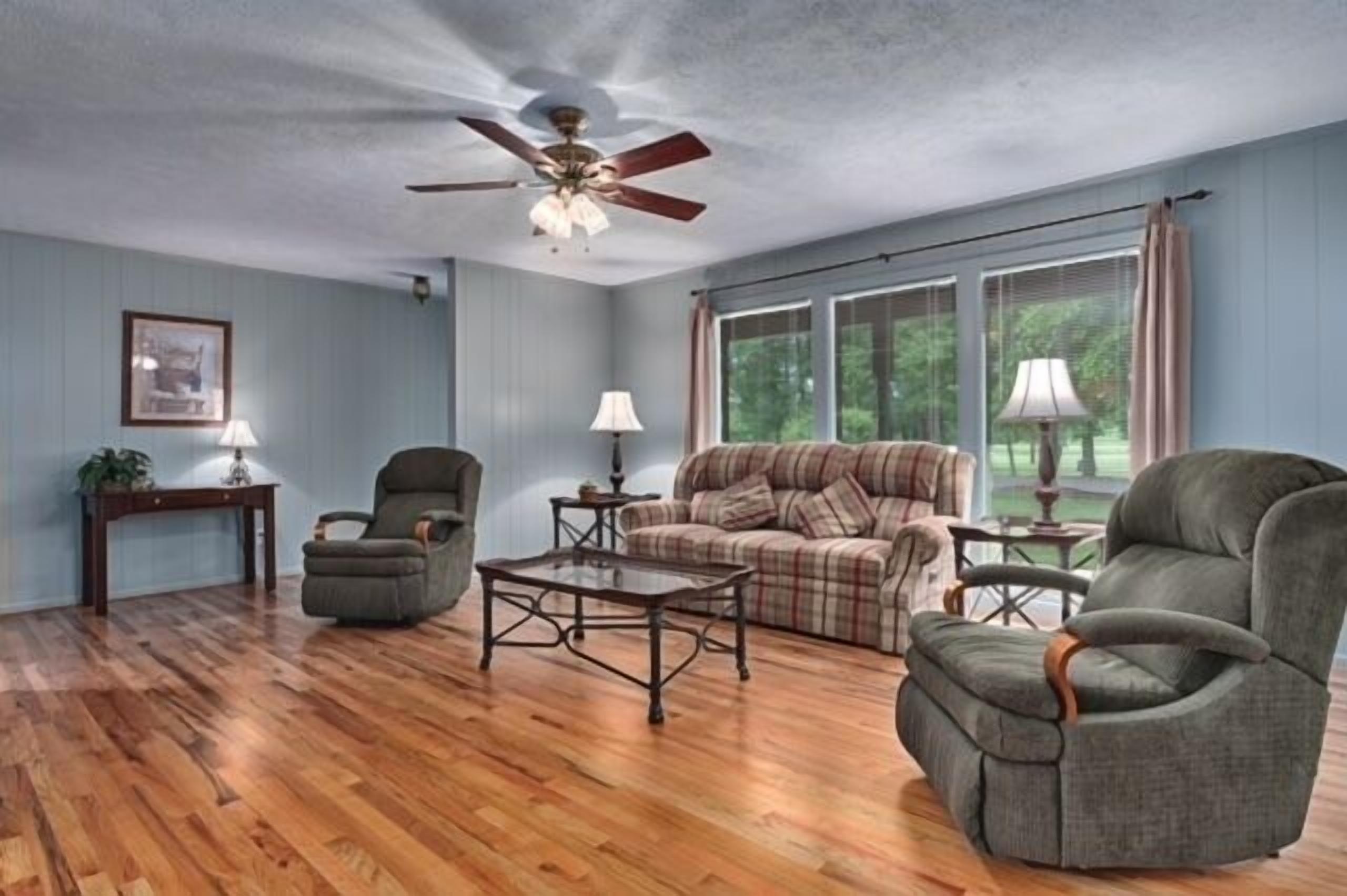 house, 3 bedrooms, fireplace, golf view | living area | flat-screen tv