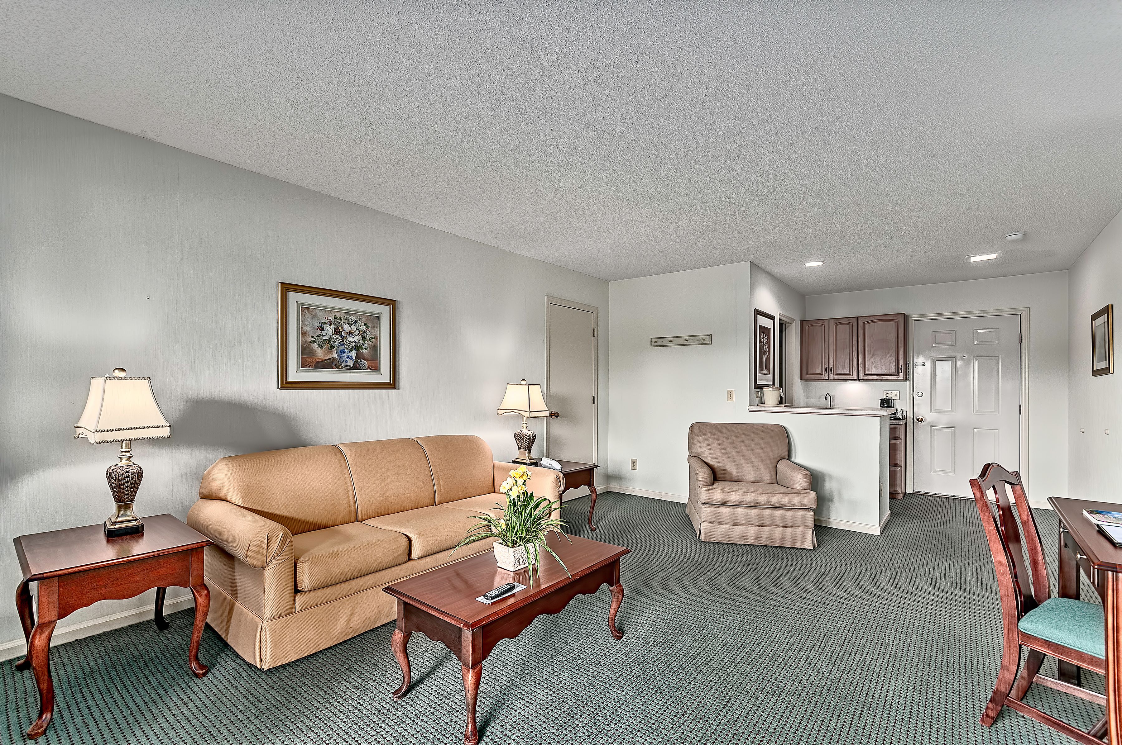 suite, 1 king bed with sofa bed, refrigerator & microwave, golf view | living area | flat-screen tv