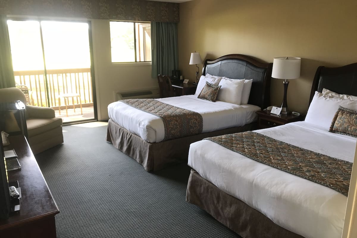 deluxe room, 2 queen beds, balcony, golf view | premium bedding, desk, blackout curtains, soundproofing