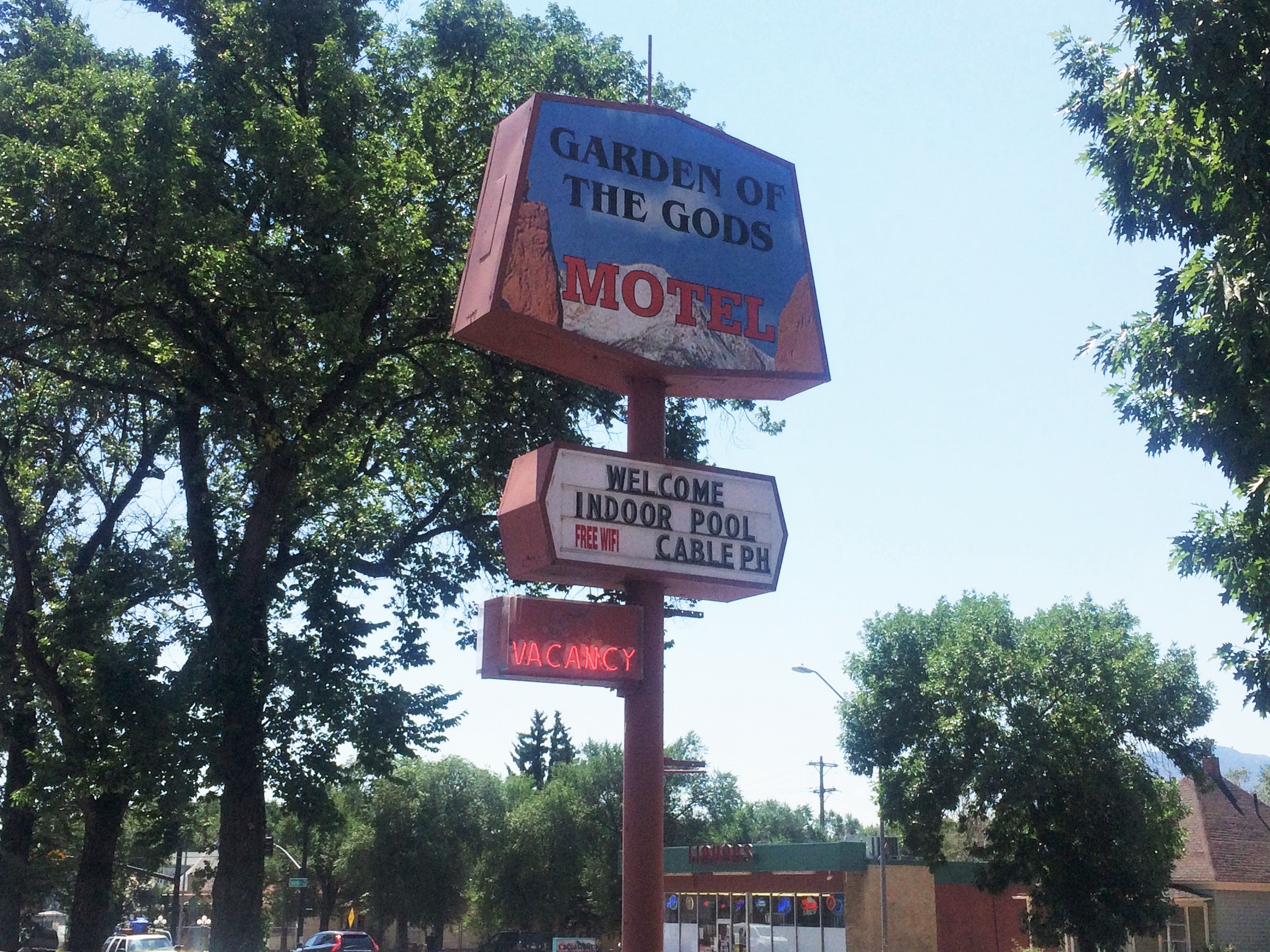 A motel sign with amenities including an indoor pool and free WiFi.