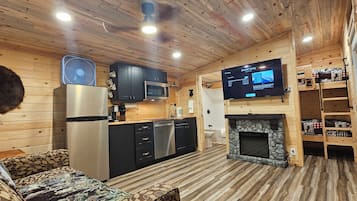 Premium Cabin, 1 Bedroom, Kitchenette | Living area | Flat-screen TV