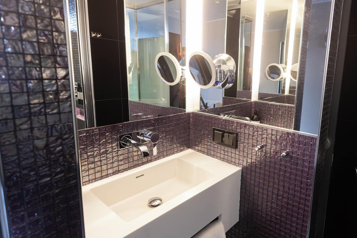 rainfall showerhead, eco-friendly toiletries, hair dryer, towels