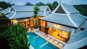 A modern resort with multiple villas, a swimming pool, and lush greenery. - Pimann Buri Pool Villas Ao Nang Krabi - SHA Plus (Krabi)