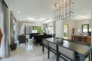 3 Bedroom Pool Villa | Living area | 40-inch TV with satellite channels, DVD player