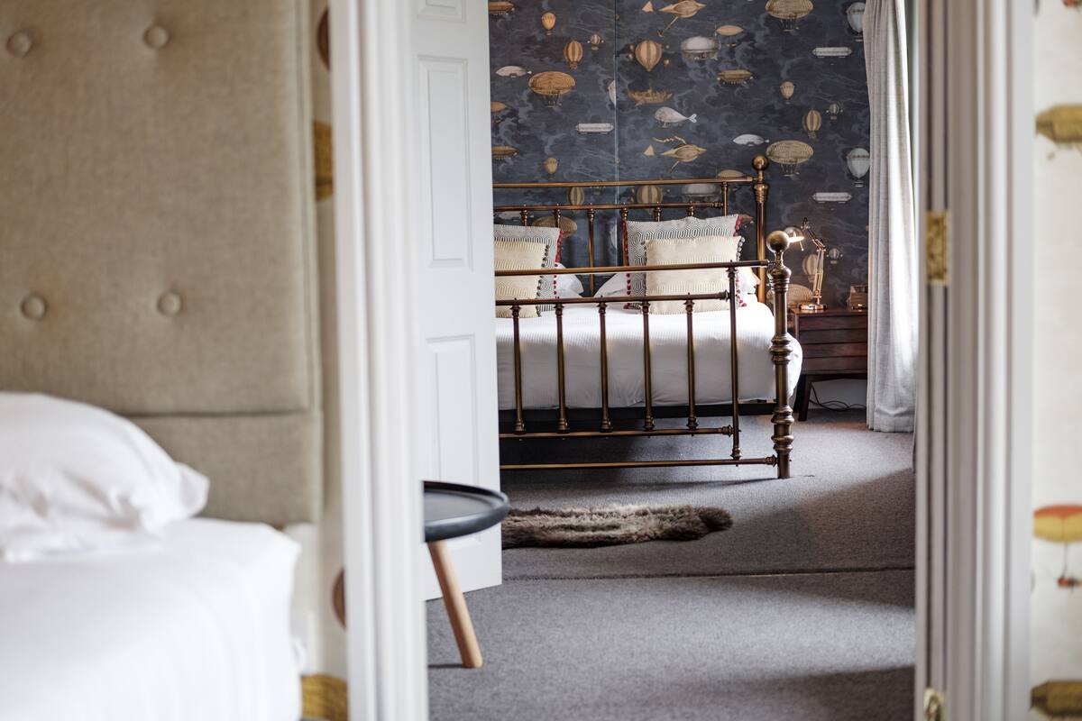 suite | premium bedding, blackout curtains, iron/ironing board, rollaway beds