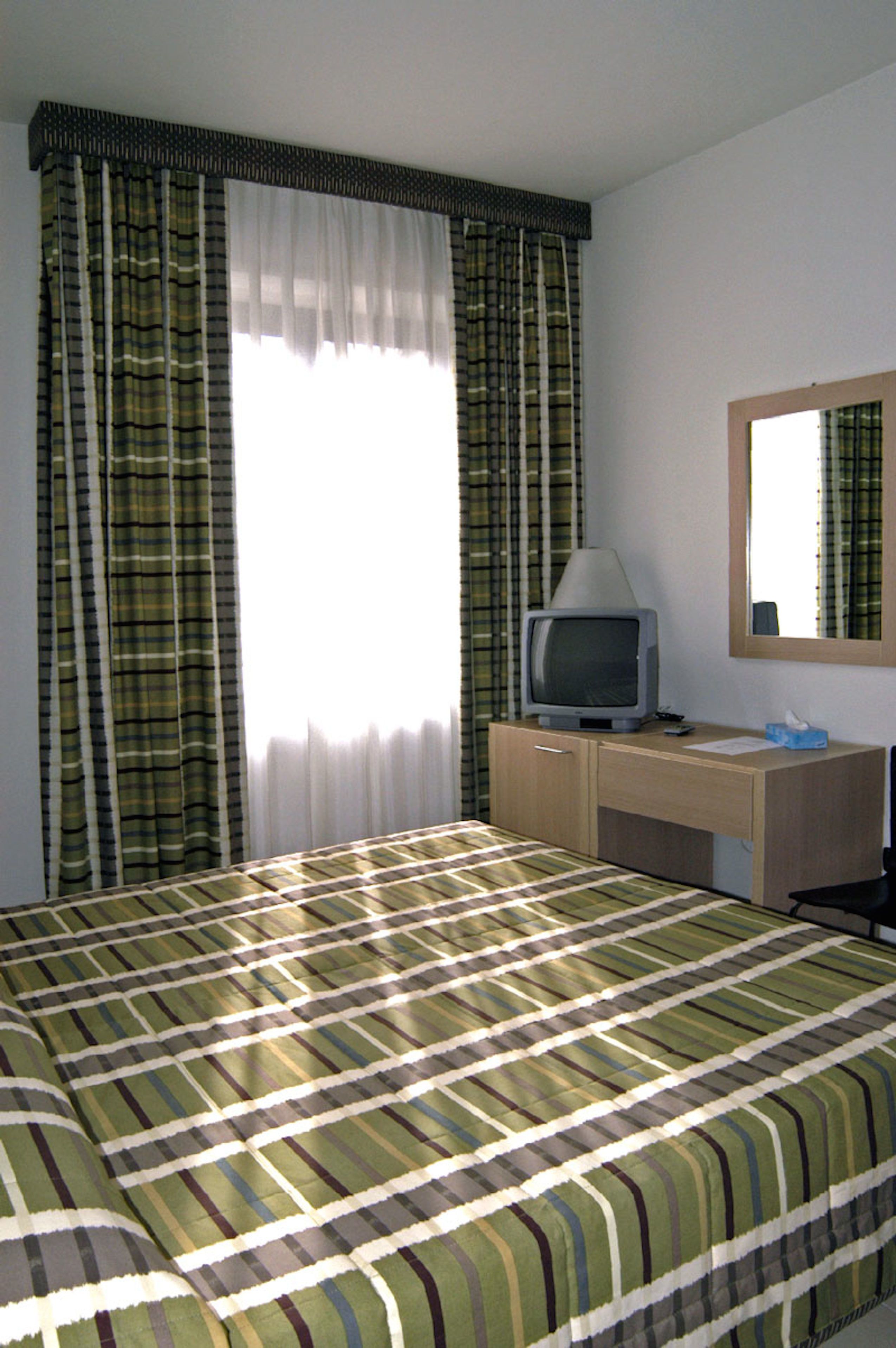 standard double room, 1 double bed | living area | flat-screen tv