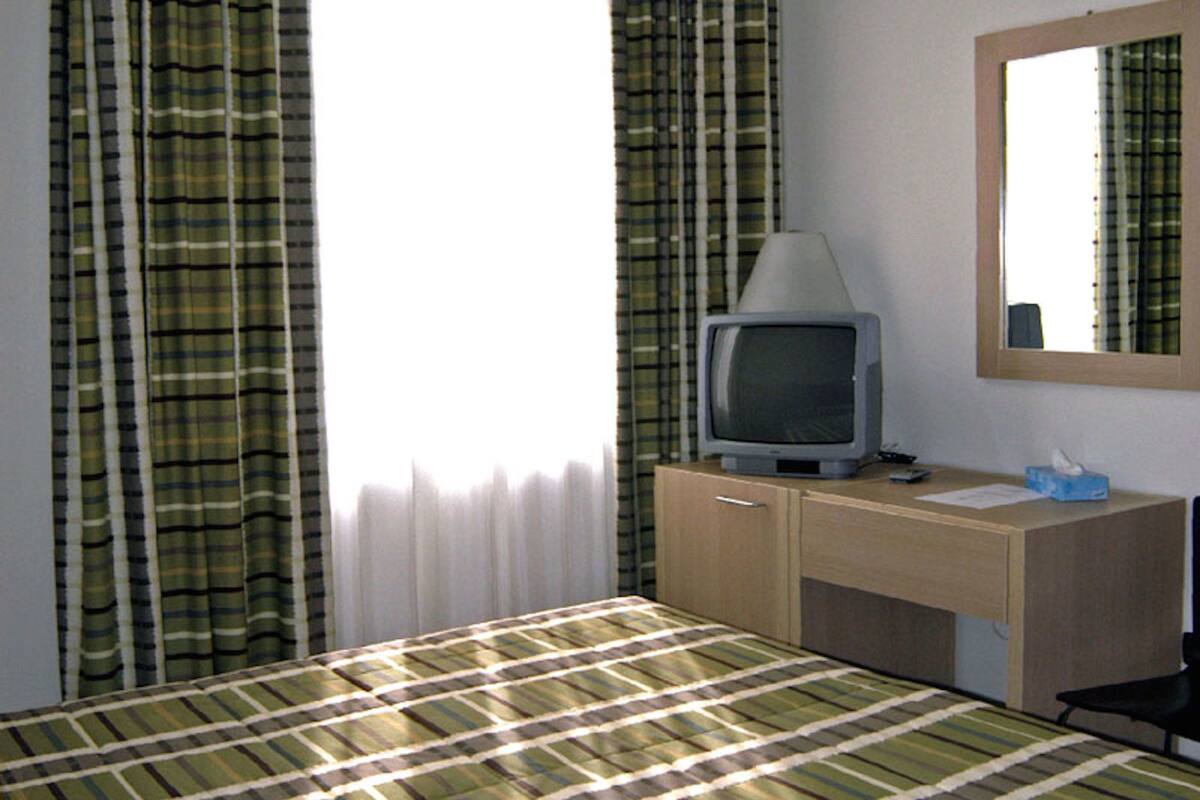 standard double room, 1 double bed | living area | flat-screen tv