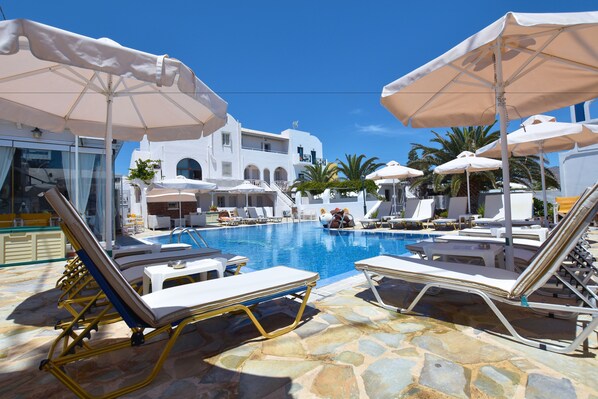 Outdoor pool, open 7:00 AM to 8:00 PM, pool umbrellas, pool loungers