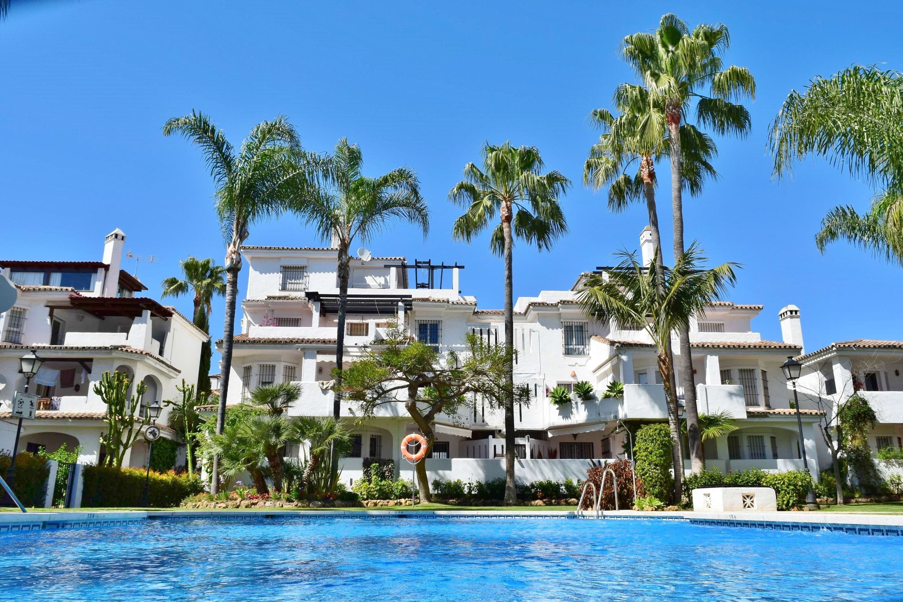 Seasonal outdoor pool, pool umbrellas, pool loungers