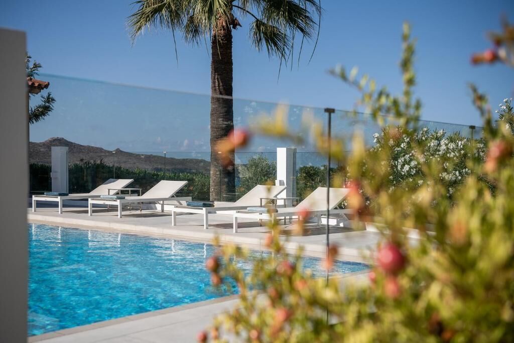 outdoor pool, a waterfall pool, open 8 am to 9:30 pm, pool umbrellas