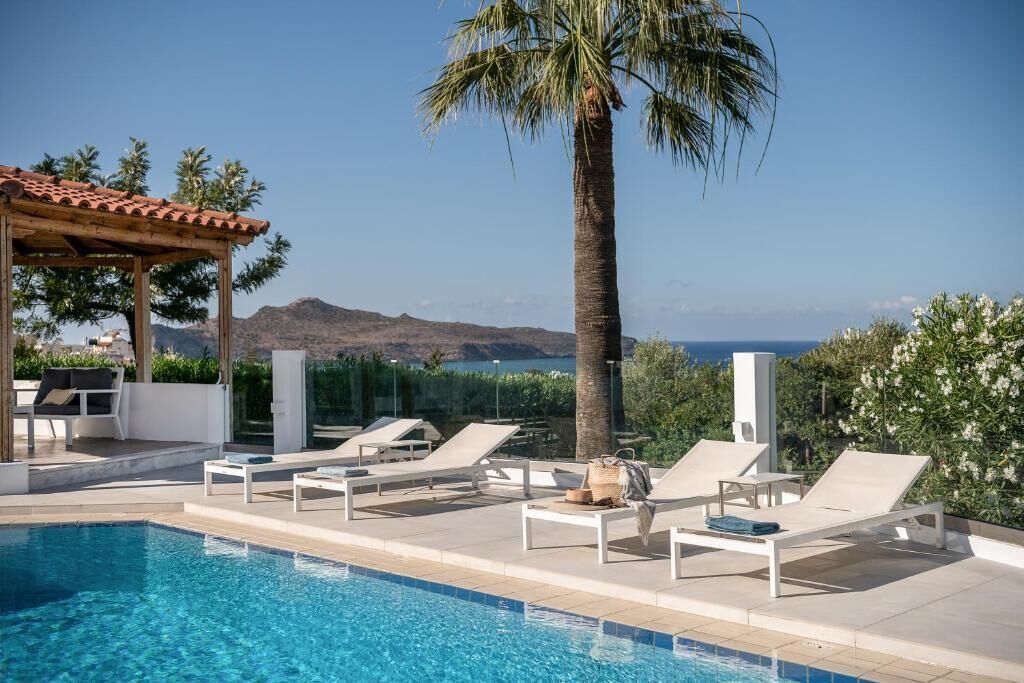 outdoor pool, a waterfall pool, open 8 am to 9:30 pm, pool umbrellas