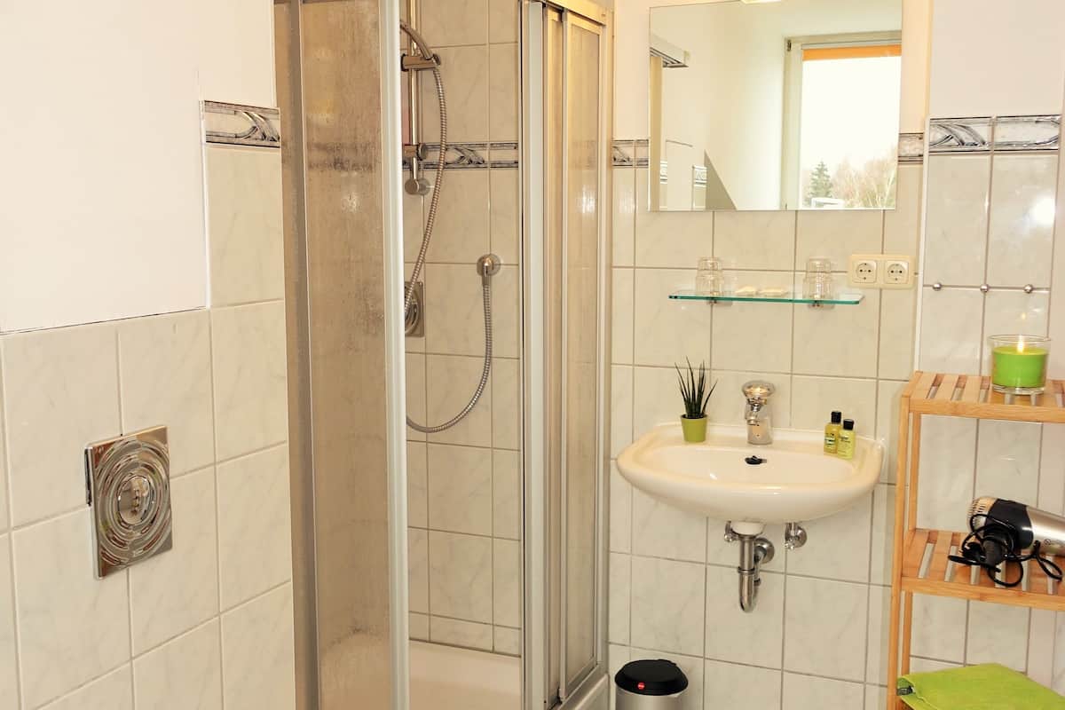 quadruple room, 2 double beds, shared bathroom | bathroom | shower, free toiletries, hair dryer, towels
