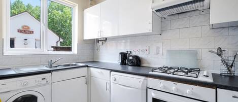 Standard Townhome, 4 Bedrooms | Private kitchen | Fridge, microwave, dishwasher, coffee/tea maker