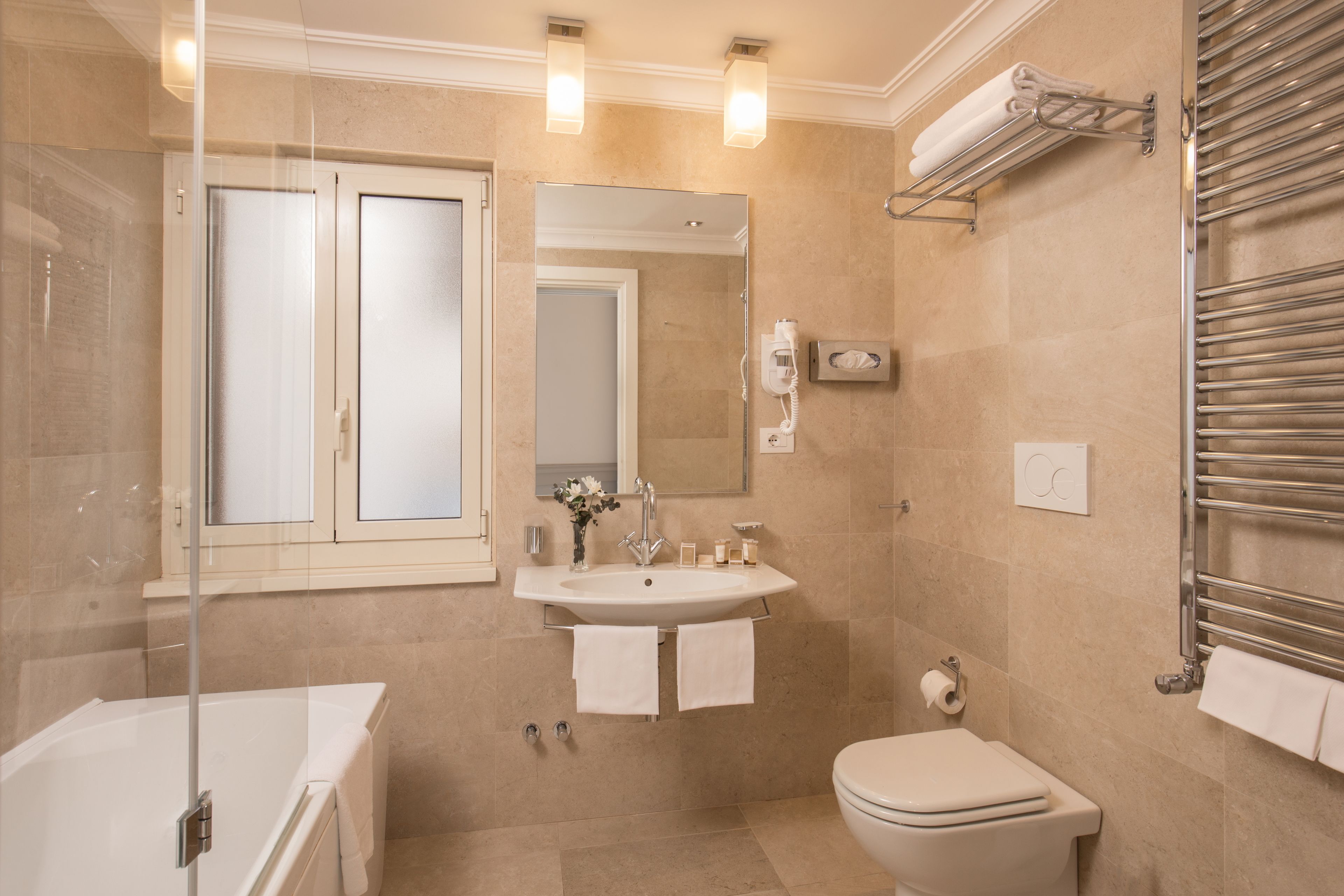 junior suite | bathroom | free toiletries, hair dryer, slippers, towels