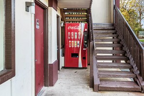 A staircase leading to a Coca-Cola vending machine. - Red Roof Inn Anderson, IN (Anderson)