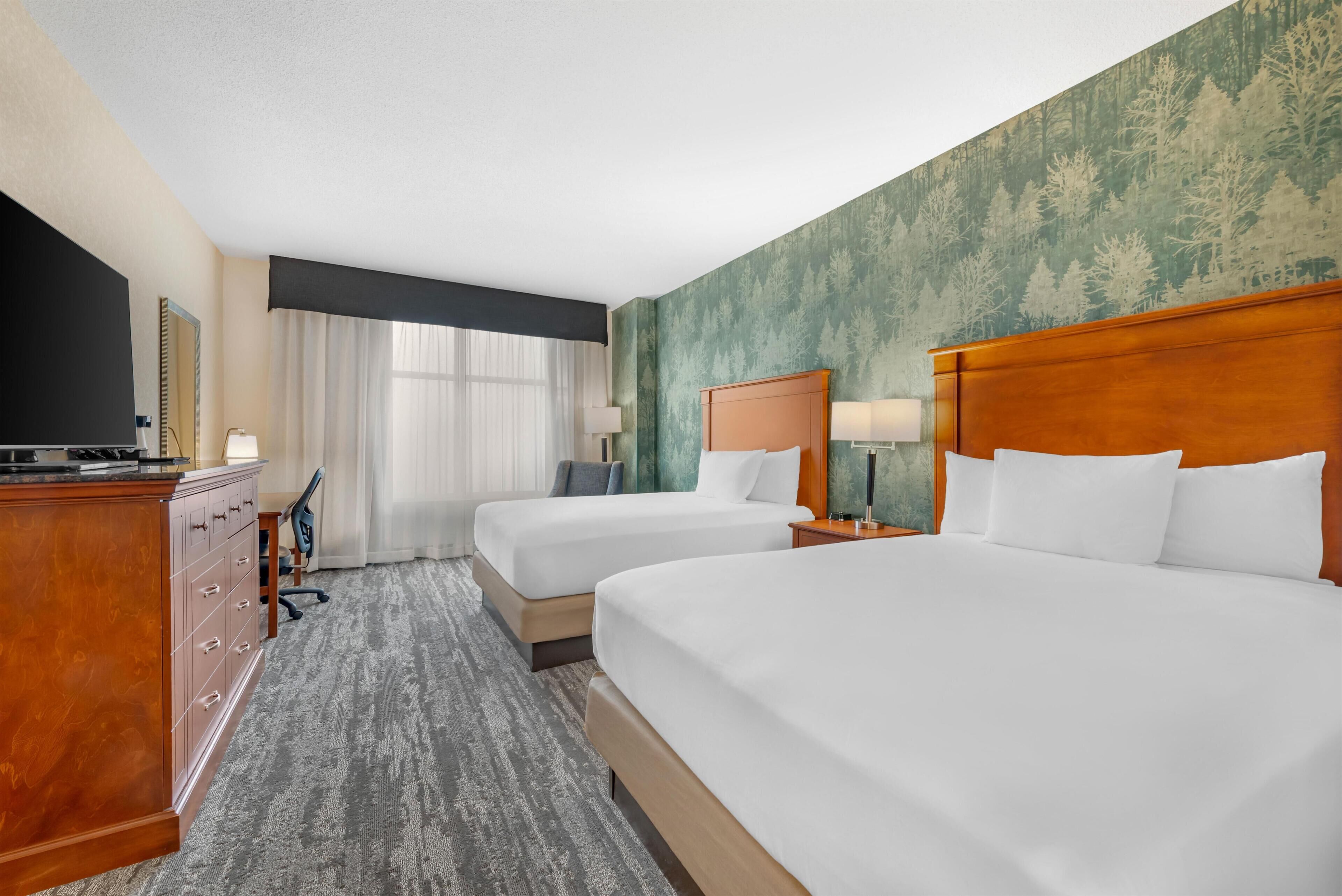 Desk, blackout drapes, iron/ironing board, free cribs/infant beds